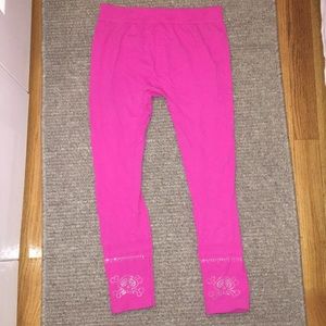 Pink leggings with skull embellishment